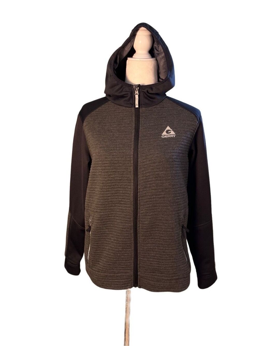 Gerry zip front hooded jacket with charcoal gray ribbed bodice and black sleeves